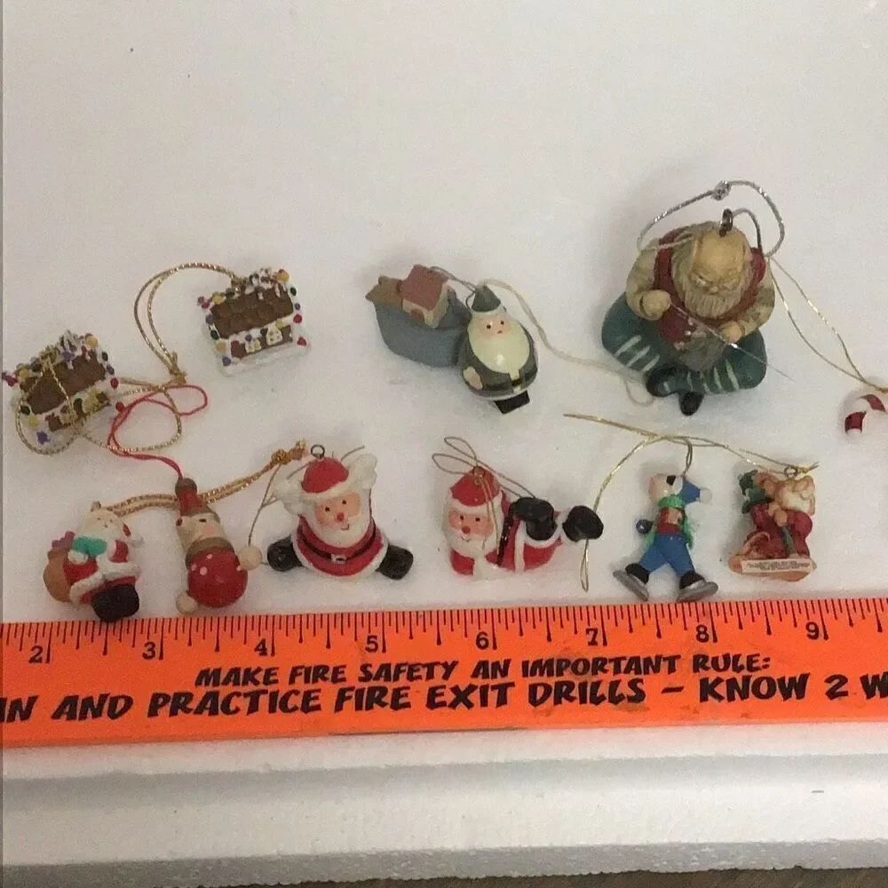 Various vintage, miniature, Santa, and gingerbread house ornaments